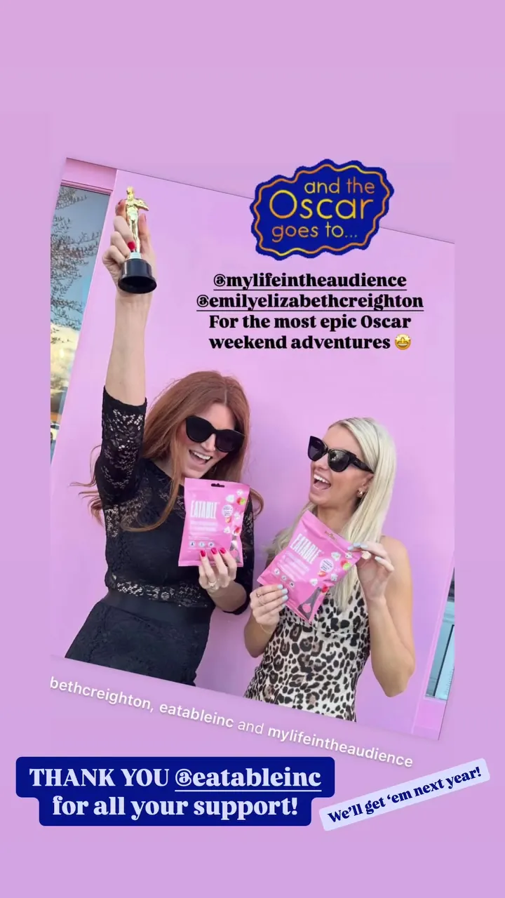 Kristin and Emily holding Eatable popcorn on an And the Oscar goes to thank-you card