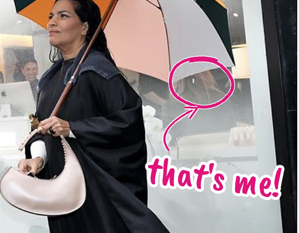 Zoomed in: Kristin circled inside the salon window, her head just under the edge of Sarita Choudhury's umbrella, with a handwritten that's me! label